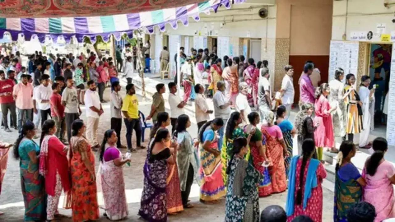 People wait in queue to vote in WB elections. Representational Pic/File/PTI